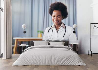 Portrait of happy black healthcare worker using digital tablet. Wall mural