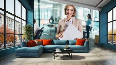 Shot of a confident young businesswoman standing in a modern office Wall mural