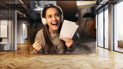 Teenage girl holding acceptance letter from university Wall mural