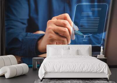 a businessman using a pen signing electronic documents on digital documents on a virtual screen Wall mural