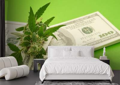 Fresh marijuana buds flower on US dollar banknotes over a green background Wall mural