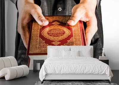 Koran in hand - holy book of Muslims ( public item of all muslims ) Wall mural