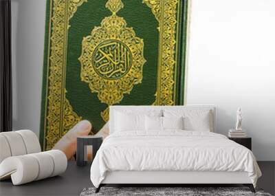 Koran in hand - holy book of Muslims ( public item of all muslims ) Wall mural