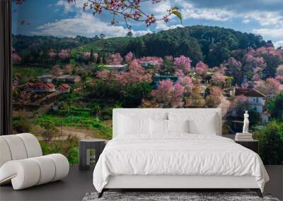 landscape of Beautiful Wild Himalayan Cherry Blooming pink Prunus cerasoides flowers at Phu Lom Lo Loei and Phitsanulok of Thailand Wall mural