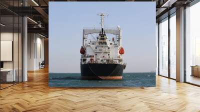 Marine cargo ship in sea. Wall mural