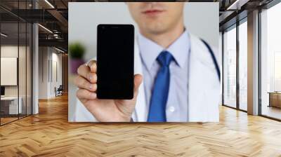 male medicine doctor holding mobile phone Wall mural