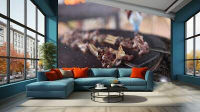 Meat skewers in barbecue picnic on open fire Wall mural