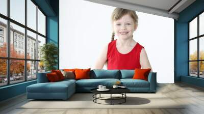 Portrait of smiling little girl with blond hair Wall mural