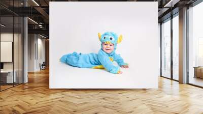 Baby dressed up for Halloween in a monster costume Wall mural