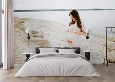 Pregnant Mom holding Belly Wall mural