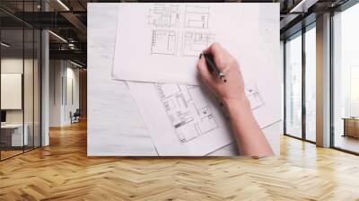 Architect drawing blueprints Wall mural