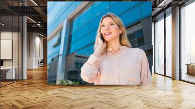 Business woman talking on the phone. Wall mural