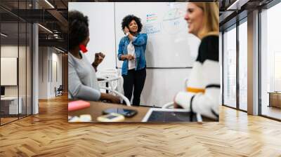 manager woman leading a brainstorming meeting. Wall mural