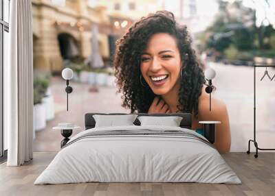 Portrait of confident woman laughing. Wall mural