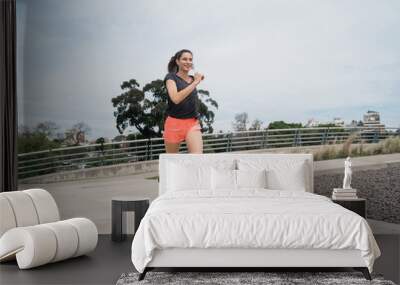 Portrait of fitness woman running. Wall mural