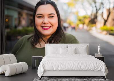 Portrait of young plus size woman. Wall mural