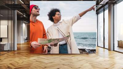 Two travelers with a map. Wall mural