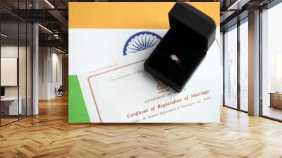 Indian Certificate of registration of marriage blank document and wedding ring on flag close up Wall mural