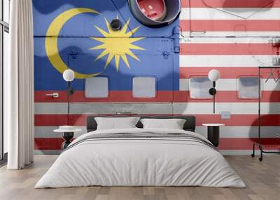 Malaysia flag depicted on side part of military armored helicopter closeup. Army forces aircraft conceptual background Wall mural