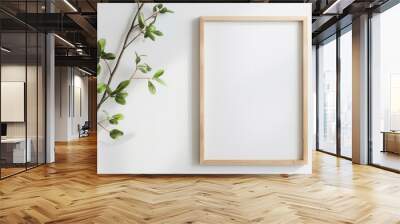 thin light wood picture frame mockup, blank canvas, white wall, neutral color palette on white background Wall mural