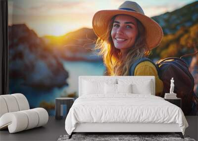 portrait of a traveler woman in a cowboy hat looking at camera at the sunset  Wall mural