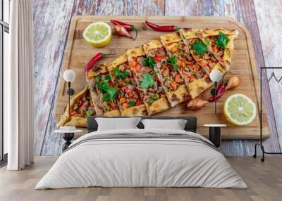 Traditional turkish baked dish pide. Turkish pizza pide, Middle eastern appetizers. Turkish cuisine. Top view. Pide with meat filling. Wall mural