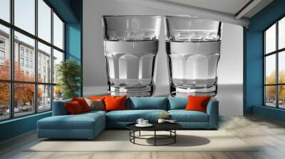 Two glasses without anything are placed one on top of the other. Wall mural