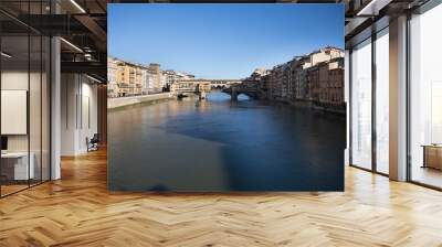 Sunny view on the Arno River and Ponte Vecchio in Florence, Italy Wall mural