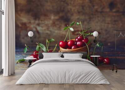 Cherries in a bowl on a wooden table Wall mural