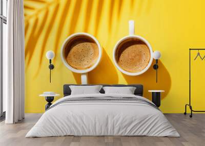 Two white cup of coffee on yellow background. Wall mural