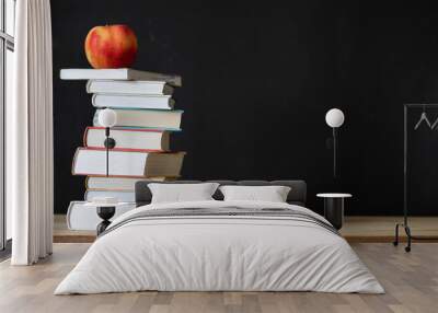 back to school concept pile of books against chalkboard Wall mural