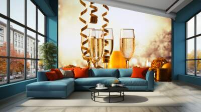 champagne glasses against holiday lights ready for New Year's eve party Wall mural