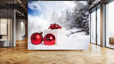 Christmas decorations and gift box in snow - snowy firs in the b Wall mural