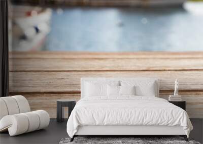 empty wooden table and sea in background Wall mural