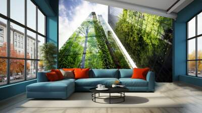 green city - double exposure of lush green forest and modern skyscrapers windows Wall mural