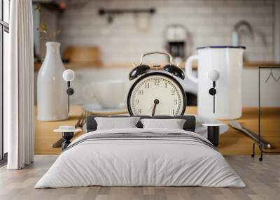 intermittent fasting concept alarm clock on kitchen table Wall mural