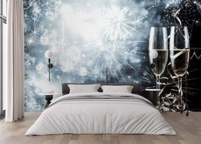 two champagne glasses with ribbons against holiday lights and fireworks - New Year celebrations Wall mural