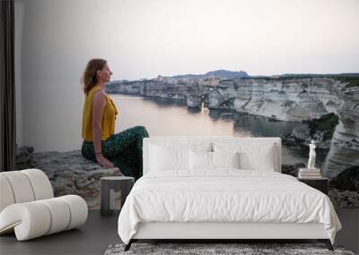 woman watching the sunset over the Town of Bonifacio  Corsica Island  France Wall mural