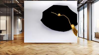 Isolated traditional black phd doctoral tam cap with gold tassel	
 Wall mural