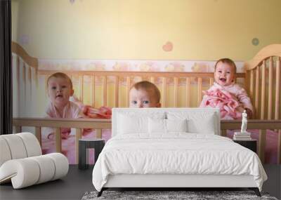 baby girls in crib - triplets Wall mural