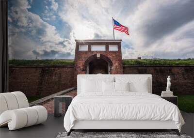 Historic American flying over the entrance to Fort McHenry National Monument, Baltimore, Maryland Wall mural