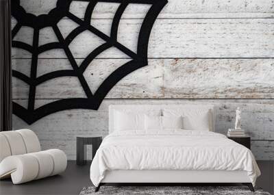 Rustic black spiderweb Halloween background concept on wood background. Copy space available Wall mural