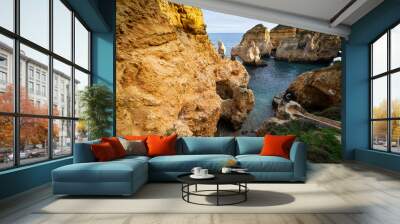 Scenic natural cliff formations and arches of Algarve coastline with turquoise water at Ponta da Piedade, in Algarve Portugal Wall mural