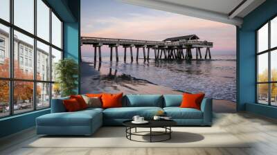 Wide angle view of the Tybee Island Pier in Georgia. Colorful sunset with pinks and purple colors in the sky Wall mural