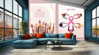 Breast cancer survival prevention concept. Group of different culture female hands holding a pink ribbon.Template. Solidarity and support for women fighting breast cancer.Cancer survivor Wall mural