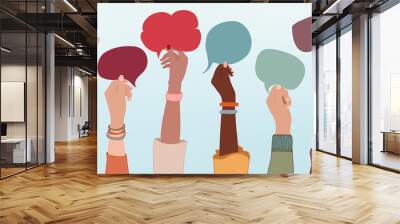 Group of multiethnic business people with raised arms holding speech bubble in hand. Colleagues from diverse races and cultures. Cooperate and collaborate.Teamwork and success concept Wall mural