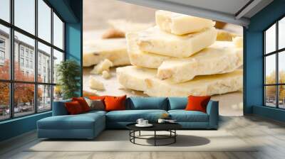 A pile of white chocolate with almonds on parchment paper. Sweet dessert Wall mural