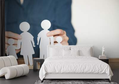 Break up and divorce. Relationship breakdown in family concept. Parting husband and wife. Female hands holding torn paper people figures. Blank copy space Wall mural