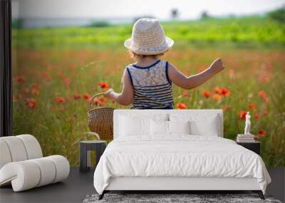 little girl in a field of poppies Wall mural