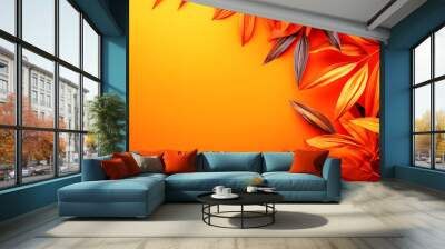 Orange and dark gray leaves on orange background with copy space. Wall mural